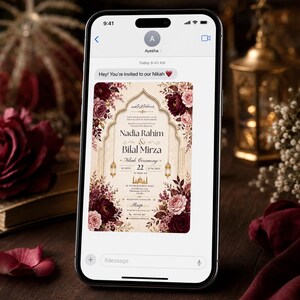 May include: A smartphone screen displaying an iMessage conversation with an invitation to a Nikah ceremony for Nadia Rahim and Bilal Mirza. The digital card features a cream background, ornate gold archway, and deep burgundy and pink floral accents.