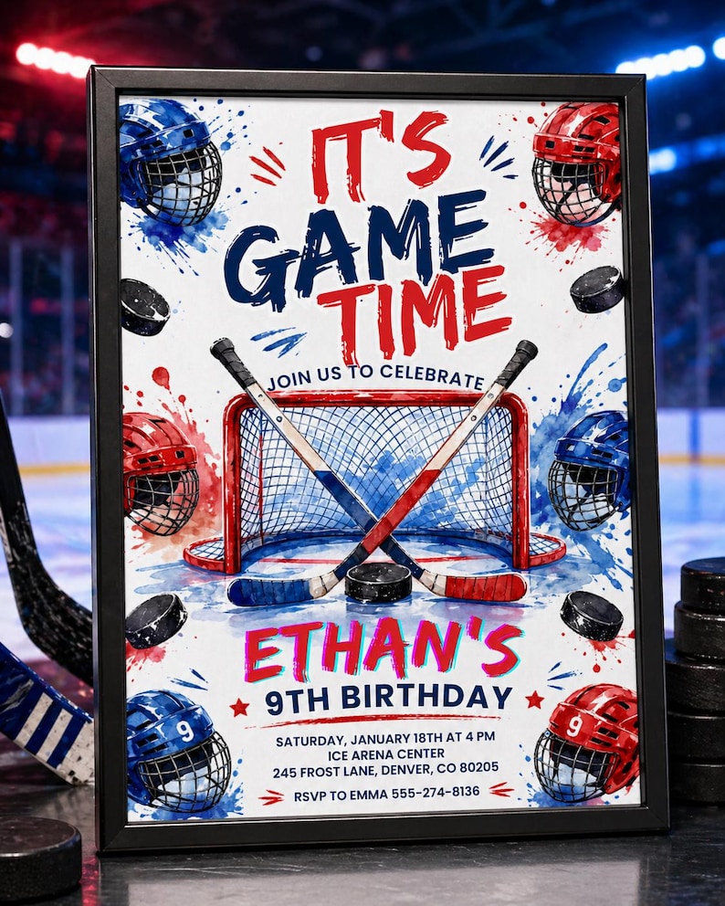 May include: A framed hockey-themed birthday party invitation. The design features a hockey net, crossed hockey sticks, pucks, and helmets in red and blue. Text reads "It's Game Time" and "Ethan's 9th Birthday".