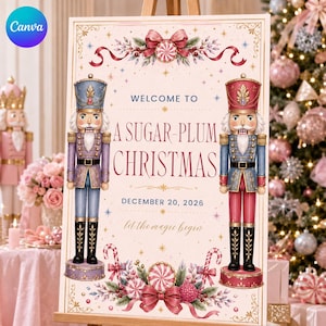 Pode incluir: Uma placa retangular com duas figuras de quebra-nozes em uniformes azul e vermelho, com o texto WELCOME TO A SUGAR-PLUM CHRISTMAS DECEMBER 20, 2026 let the magic begin. O design inclui laços decorativos, doces e detalhes de estrelas douradas.