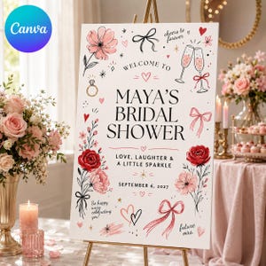 May include: A white rectangular bridal shower welcome sign featuring black text that reads Maya's Bridal Shower, Love, Laughter & A Little Sparkle, and September 6, 2027. The sign is decorated with pink and red floral illustrations, bows, and hearts.