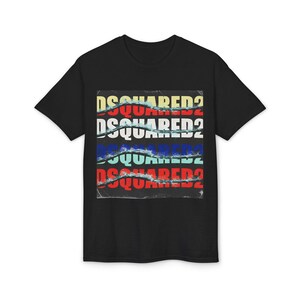 May include: Black crew neck t-shirt with a graphic design. The design features the word "DSQUARED2" stacked four times in different colors: yellow, red, blue, and teal. The text appears to be partially torn, giving it a distressed look.