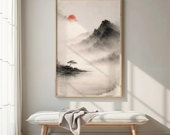 May include: A framed landscape art print featuring a serene mountain scene with a red sun, a lone tree, and a body of water. The artwork is in shades of gray and beige, with a wooden frame. The print is displayed above a white bench.