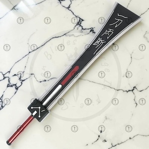 May include: A white ceramic mug with a black handle and the text "But First, Coffee" in a black, bold font. The mug is on a white surface.