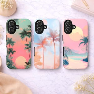 May include: Three phone cases with tropical sunset designs. Each case features a different colour scheme: green and pink, blue and orange, and pink and yellow. Palm trees and a setting sun are depicted on each case.