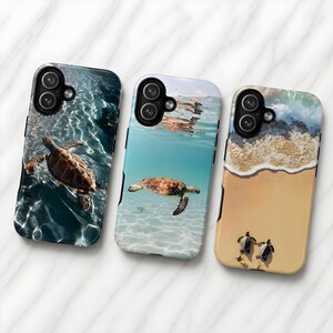 May include: Three phone cases with sea turtle designs. One case shows a turtle swimming in clear water, another shows a turtle underwater, and the third features baby turtles on a sandy beach. The cases have black edges and are designed for a smartphone.
