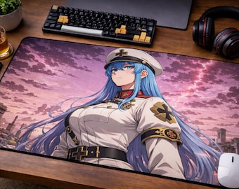 May include: A rectangular desk mat featuring an anime-style illustration of a character with long blue hair wearing a white military-inspired uniform with gold and black cross emblems, set against a backdrop of a pink and purple sunset sky.
