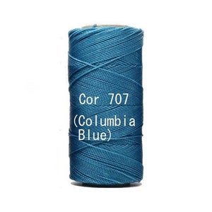 May include: A teal-coloured spool of thread, labelled Cor 707 (Columbia Blue), against a white backdrop. The thread is tightly wound. Suitable for crafting, sewing, and textile projects. The colour is a vibrant teal.
