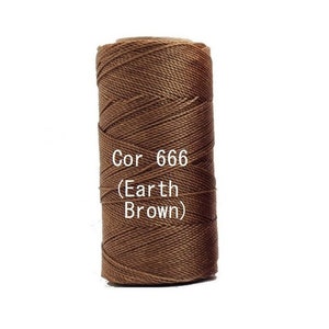 May include: A spool of earth brown cord, labeled "Cor 666 (Earth Brown)". The cord is tightly wound, showing a textured surface. The color is a rich, warm brown, suitable for various crafting projects.