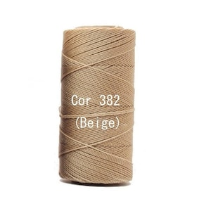 May include: A spool of beige twine, tightly wound and ready for use. The text "Cor 382 (Beige)" is printed on the spool. This natural-toned twine is suitable for various crafting and decorative projects.