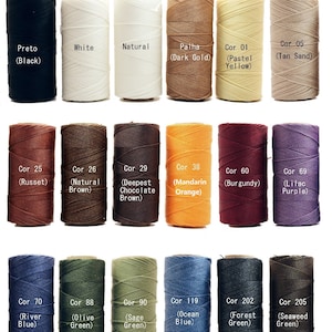 May include: A collection of 1mm waxed linen thread spools in various colors, including black, white, natural, dark gold, pastel yellow, tan sand, russet, natural brown, deepest chocolate brown, mandarin orange, burgundy, lilac purple, river blue, olive green, sage green, ocean blue, forest green, and seaweed green.