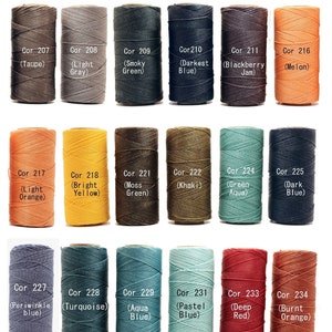 May include: A collection of 1mm waxed linen cords in various colors, including taupe, light gray, smoky green, darkest blue, blackberry jam, melon, light orange, bright yellow, moss green, khaki, green aqua, dark blue, periwinkle blue, turquoise, aqua blue, pastel blue, deep red, and burnt orange. Each cord is labeled with its color name and corresponding code number.