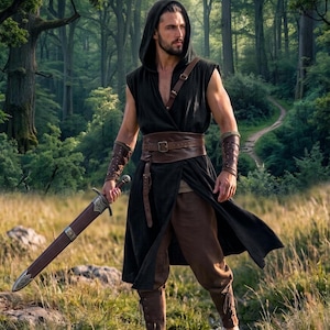 May include: A sleeveless black hooded tunic with a brown leather belt and shoulder strap, paired with brown trousers and matching leather bracers. A sword with a brown scabbard is held in one hand, featuring metallic accents on the hilt and tip.