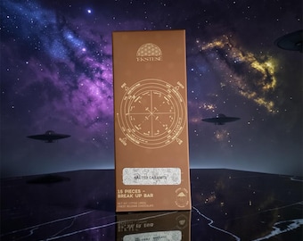 May include: A rectangular brown chocolate bar box labeled Ekstese Salted Caramel. The front features a circular diagram with text including Fire, Earth, Water, and Air. It states 15 Pieces - Break Up Bar and Net Wt 1.7 oz (48g) of finest Belgian chocolate.