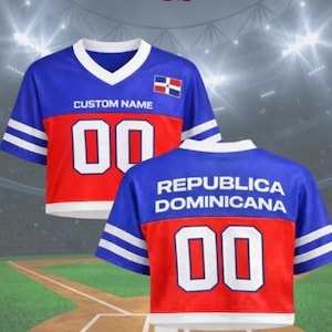 May include: Blue, red, and white baseball jersey with the text "CUSTOM NAME" and the number "00". The jersey features the Dominican Republic flag and the words "AEROGEAR US" at the top. The back of the jersey says "REPUBLICA DOMINICANA".