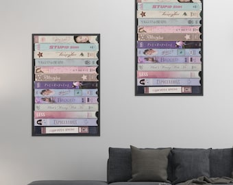 May include: Two framed wall art prints featuring stacks of VHS tapes with pastel-colored spines. The titles include Stupid Song, Honeybee, Maggots & Brains, U Me <3, Messy Way, Purple, Other Love, Begged, What's Wrong With Me, Less, Expectations, and Cigarette Smoke.