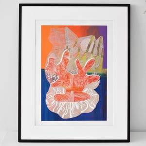 May include: Abstract art print in a black frame. The artwork features a vibrant composition with orange, blue, and purple hues. The central focus is a coral-like shape in shades of red and white, creating a dynamic visual experience.