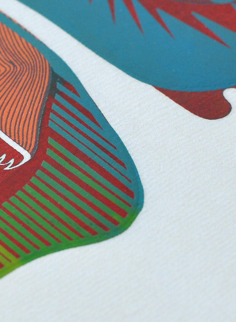 May include: Close-up of a white fabric with a colorful abstract design. The design features orange, teal, red, and green shapes. The artwork has a graphic, illustrative style, with a focus on bold colors and lines.