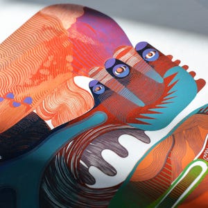 May include: Abstract art print featuring a close-up of a colorful design. The artwork showcases a blend of orange, red, blue, and purple hues with intricate line work. The composition includes organic shapes and patterns, creating a visually engaging piece.