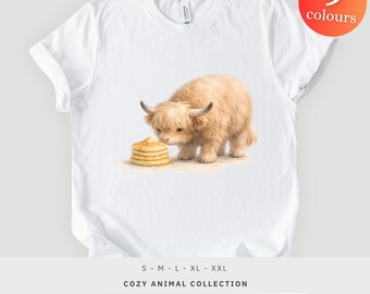 Camiseta con estampado de vaca de las Tierras Altas y tortitas, diseño de animal de granja esponjoso, regalo para amantes del desayuno, camiseta unisex.