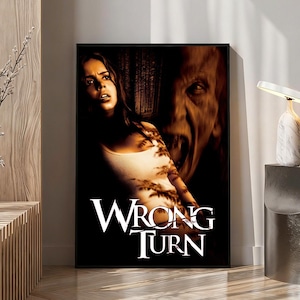May include: A rectangular movie poster for Wrong Turn featuring a dark, high-contrast scene. A woman with a frightened expression wears a white tank top, positioned in front of a large, shadowy, distorted face. The text Wrong Turn is in white.