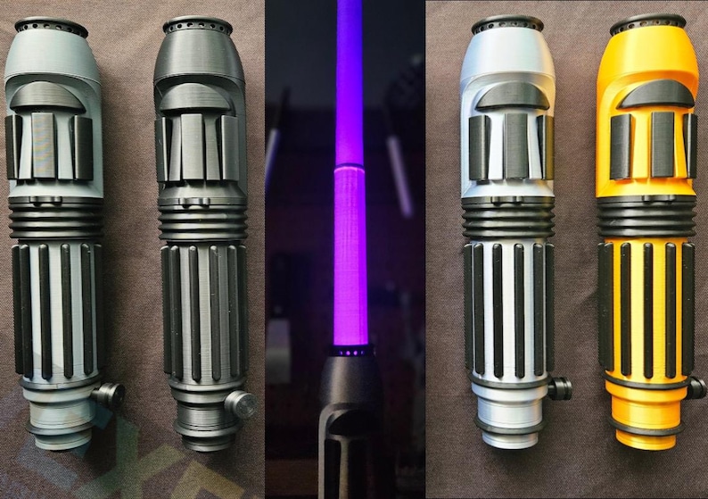 May include: A collection of five cylindrical lightsaber hilts featuring ribbed grips and protruding control switches. Four hilts are displayed in various solid colours including light grey, dark grey, silver, and yellow, while one central hilt emits a bright purple blade.