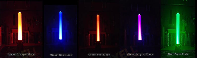 May include: Five vertical light-up blades in orange, blue, red, purple, and green. Each blade is labelled at the bottom with text: Clear Orange Blade, Clear Blue Blade, Clear Red Blade, Clear Purple Blade, and Clear Green Blade.