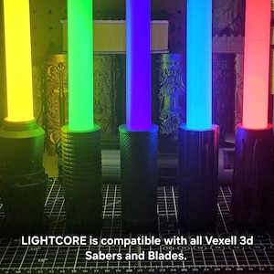May include: Five cylindrical light sabers with glowing yellow, green, purple, blue, and red blades attached to black textured handles. The text LIGHTCORE is compatible with all Vexell 3d Sabers and Blades is printed at the bottom of the image.