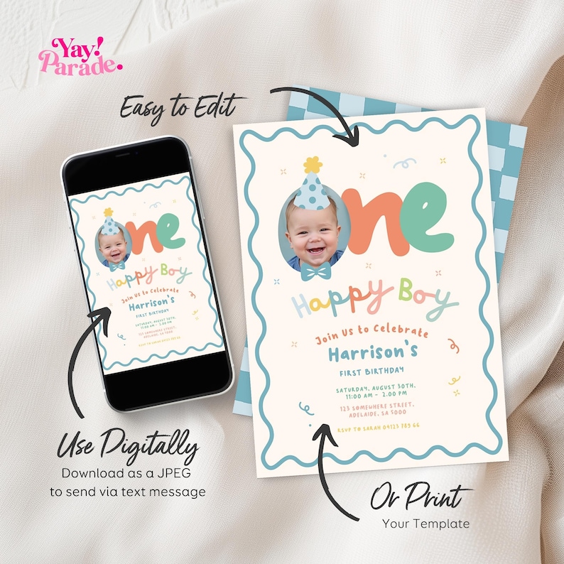 May include: A digital and printed first birthday invitation. The invitation features a photo of a baby wearing a party hat, the words "Happy Boy," and event details. The invitation is displayed on a smartphone and a printed card.