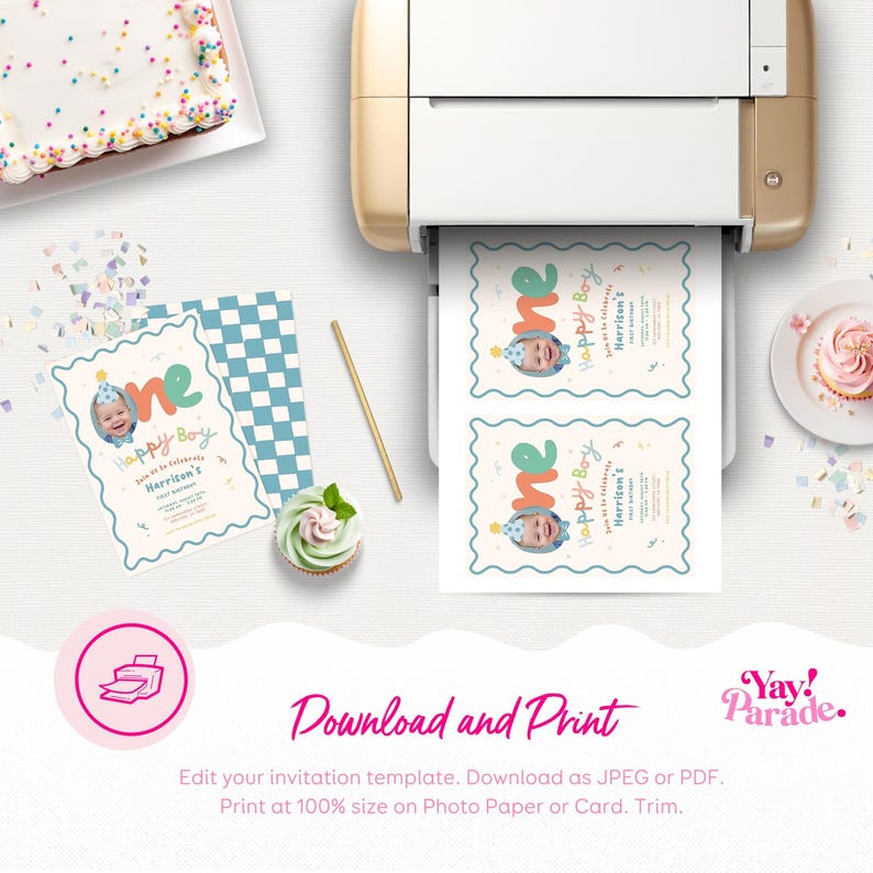 May include: A birthday invitation with the text "one" and "Happy Boy" printed on it. The invitation has a photo of a baby and is being printed from a gold printer. A cupcake, cake, and confetti are also visible.