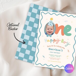 May include: A birthday invitation with a photo of a baby wearing a party hat. The invitation features the words "Happy Boy" and "One" in colorful lettering. The back of the invitation has a blue and white checkered pattern.