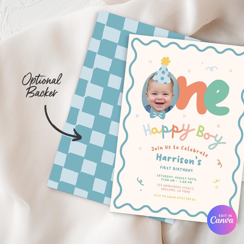 May include: A birthday invitation with a photo of a baby wearing a party hat. The invitation features the words "Happy Boy" and "One" in colorful lettering. The back of the invitation has a blue and white checkered pattern.