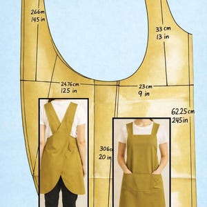 Peut inclure: Un patron de tablier moutarde avec des mesures en centimètres et en pouces. Le patron comprend deux styles de tablier, l'un avec un dos croisé et l'autre avec une encolure carrée et des poches. Le texte "Diseño Al Viento" est en bas.