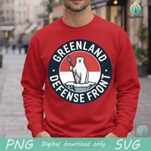 May include: Red sweatshirt featuring a circular graphic with a polar bear holding a spear, the words "GREENLAND DEFENSE FRONT" in a navy blue circle, and a red and white background. The bottom of the image has the text "PNG Digital download only SVG".
