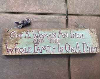 Farmhouse wall hanging "Give a woman an inch and the whole family is on a diet