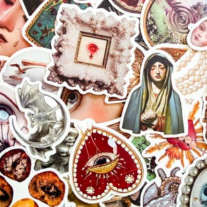 May include: A collection of assorted stickers with a vintage aesthetic. The stickers feature a variety of designs, including a framed rose, a silver bat and moon, a heart with an eye, and a religious figure. The color palette includes red, white, silver, and teal.