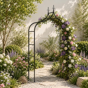 May include: A black metal garden arch with a pointed top finial, featuring a climbing vine covered in purple, white, and pink flowers. The arch stands over a stone path in a garden setting with green foliage and various blooming flowers.