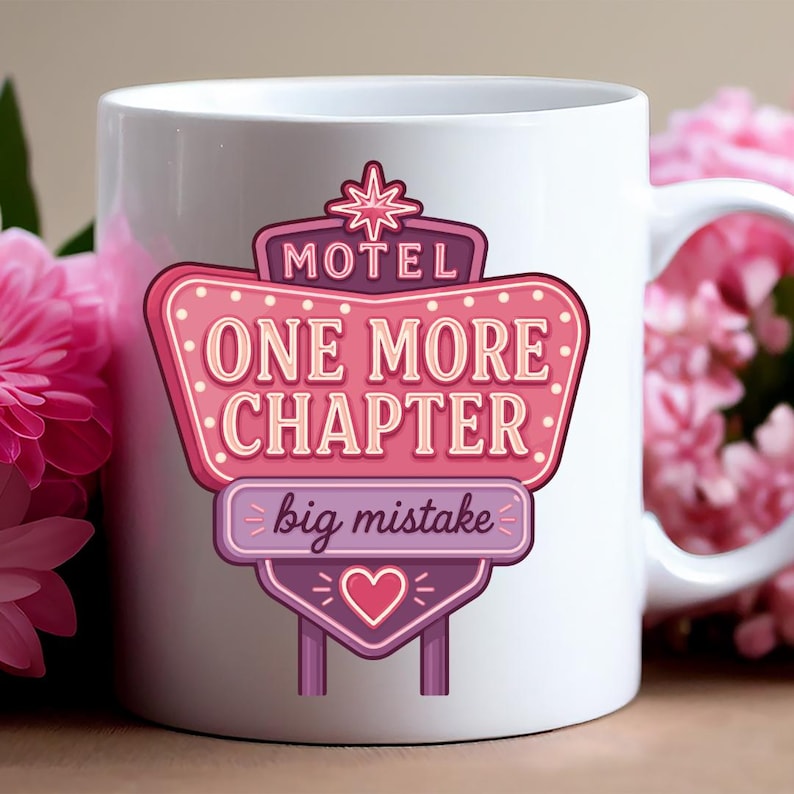 May include: A white ceramic mug featuring a graphic of a pink and purple motel sign. The sign displays the text MOTEL, ONE MORE CHAPTER, and big mistake, accented with a star at the top and a heart at the bottom, all in a retro neon style.