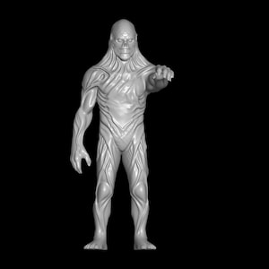 May include: A gray, three-dimensional figure of a humanoid creature with a textured, veiny appearance. The figure is standing with one arm outstretched, and the background is black.