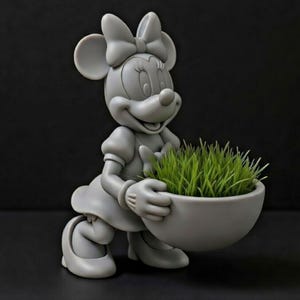 May include: A gray Minnie Mouse figurine holding a gray bowl filled with green grass. The figurine has a large bow on her head and is smiling. The background is black.