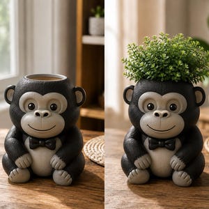 May include: A charming monkey-shaped plant pot in black and beige, featuring a smiling face and a bow tie. The pot is filled with green foliage. Ideal for adding a playful touch to any room, this pot measures approximately 20 cm in height.
