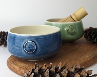 Porcelain matcha bowl | Available in green or blue | Adorned with a tea leaf stamp | Handmade in Canada