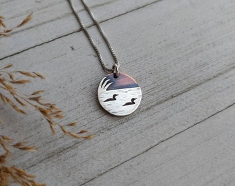 Loons on the lake - mixed metal loon wildlife pendant necklace