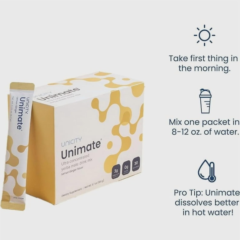May include: A box and packet of Unicity Unimate yerba mate drink mix. The box is white with a yellow abstract design and the text "Unimate". The packet is light yellow with the text "Unimate Lemon Ginger". Instructions are included.