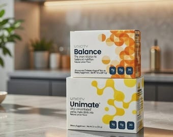 Paquete de yerba mate Unicity Balance y Unimate con sabores naranja y limón