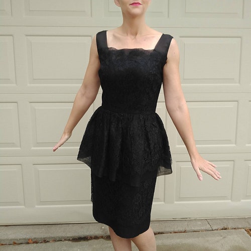 peplum cocktail dress style with thick straps Exude regal elegance in this exquisitely rendered Jovani 63611 masterpiece Black ORGANZA And LACE Cocktail