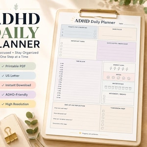 May include: An ADHD Daily Planner printable sheet on a clipboard with sections for top priorities, main focus, tasks, time blocks, energy levels, mood, water intake, movement, reflection, and prep. Text includes ADHD DAILY PLANNER and Stay Focused.