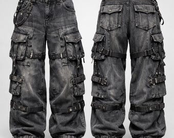 May include: A pair of gray denim cargo pants with multiple pockets and black straps. The pants have a relaxed fit and feature a drawstring at the ankles. The design includes metal hardware and a chain detail.
