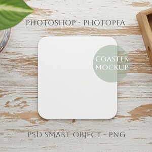 May include: A square white coaster mockup with rounded corners on a light wood surface. The text "COASTER MOCKUP" is partially visible. A wooden tray with two clear glasses and a potted plant are also in the image.