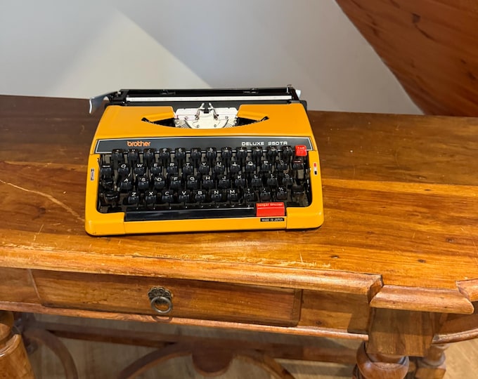 Featured listing image: Vintage Brother Deluxe 250TR Typewriter | Mustard Yellow 1970s Portable QWERTY (With Case)