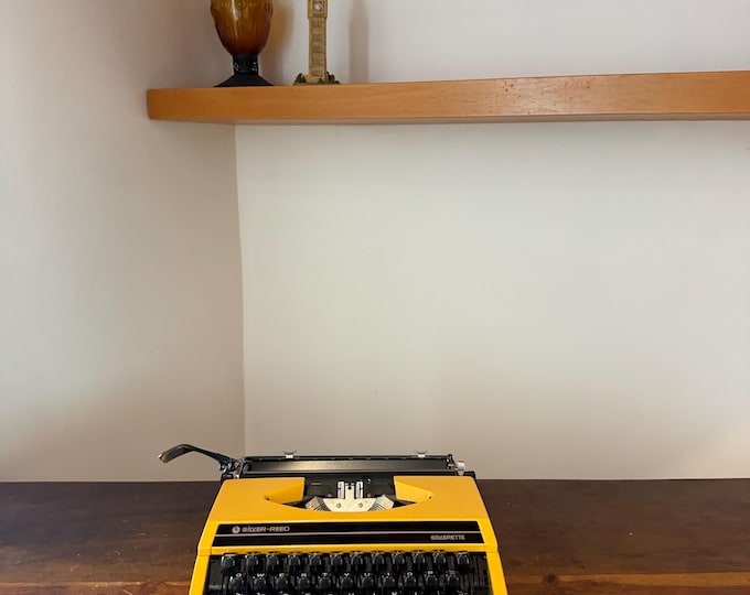 Featured listing image: Yellow Silverette Typewriter, Working Vintage 1970s Portable
